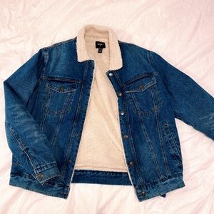 Jean jacket with faux fur inside.